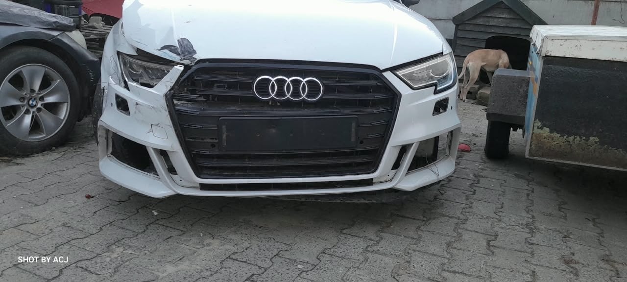 White Audi front-end collision damage before repair