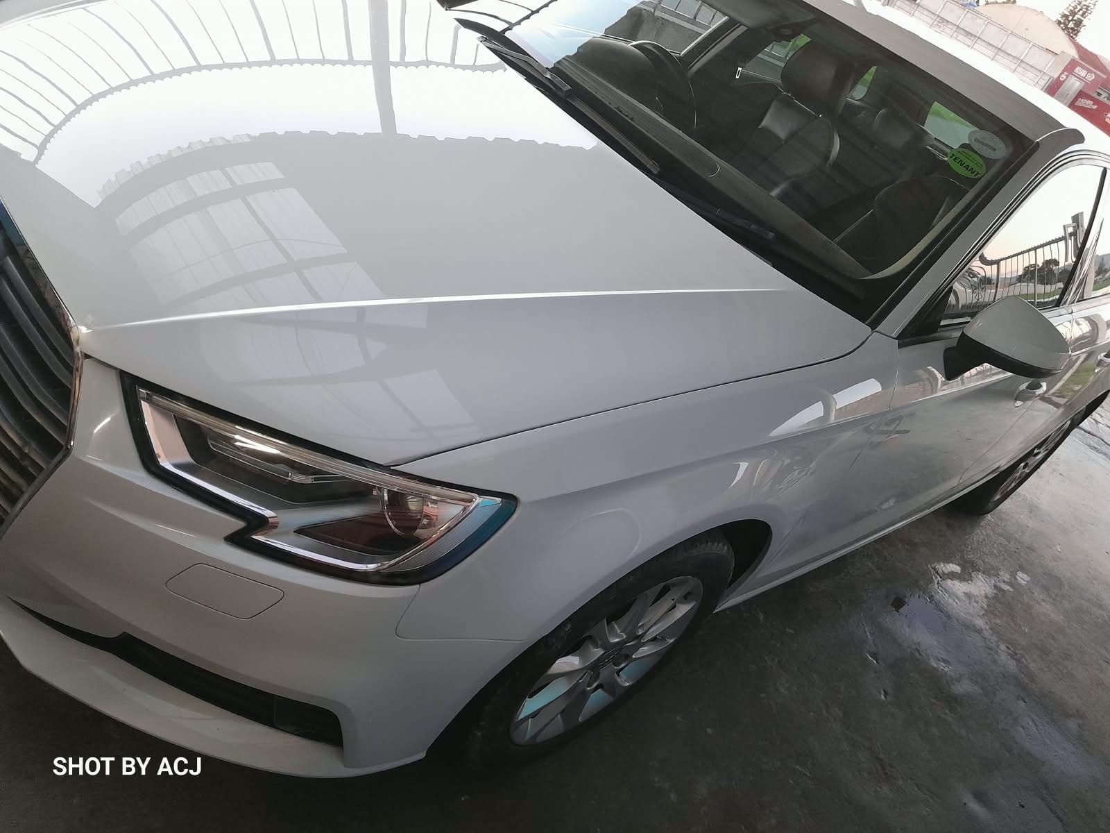White Audi front-left finish after ACJ repair