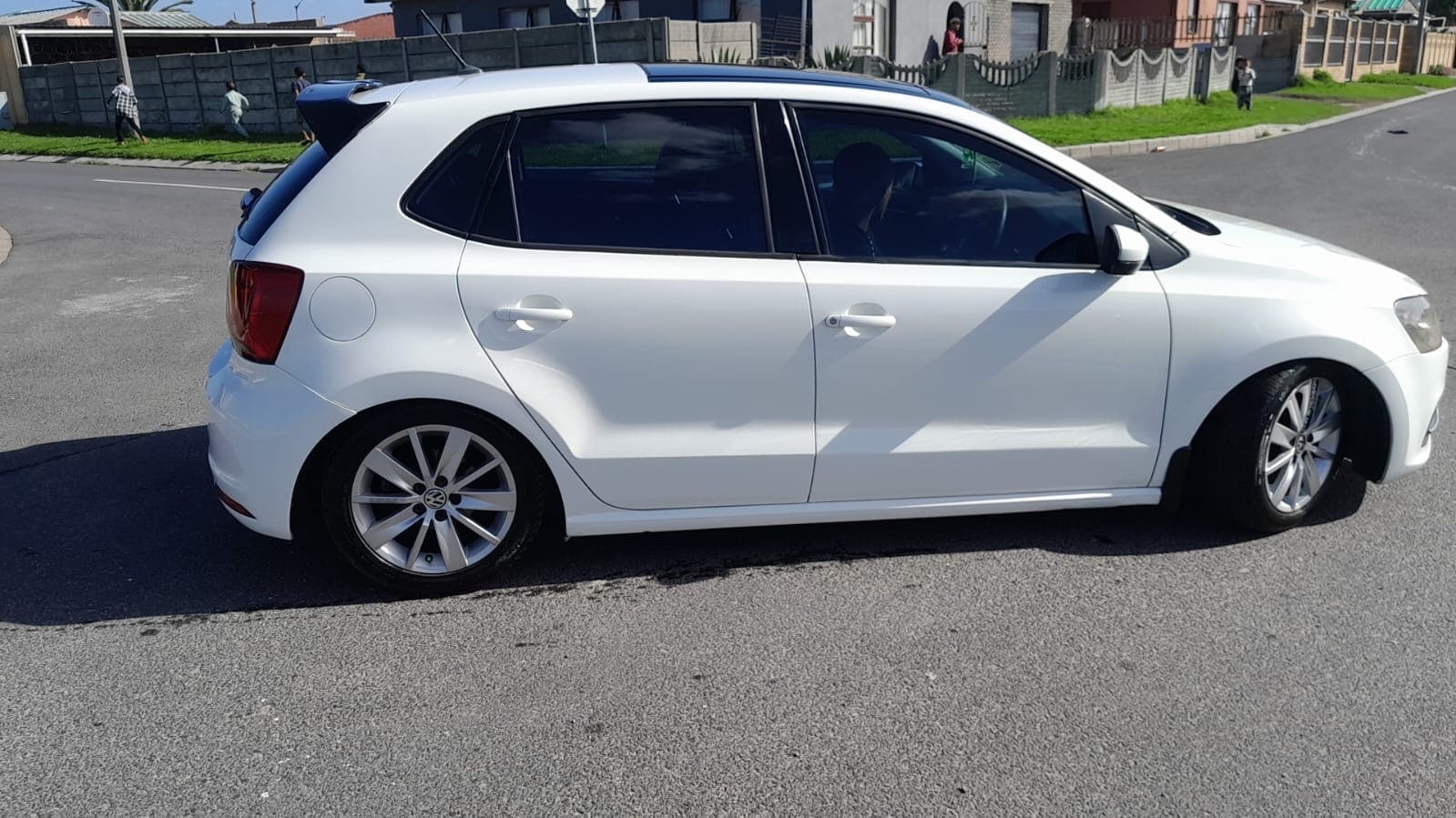 White Volkswagen Polo full side profile after ACJ repair